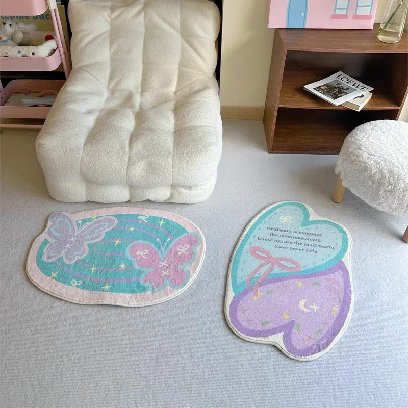 Pastel butterfly and heart bath mats styled together in a soft pink and cream room