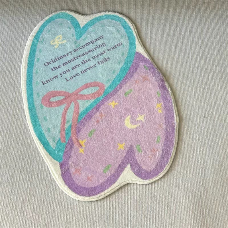 Pastel heart bath mat with aqua heart, pink bow, lavender panel, stars and moon