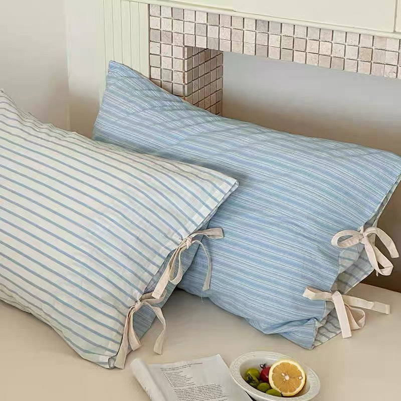 Pastel mint striped pillow cover in soft cotton, Korean-inspired bedroom accessory.