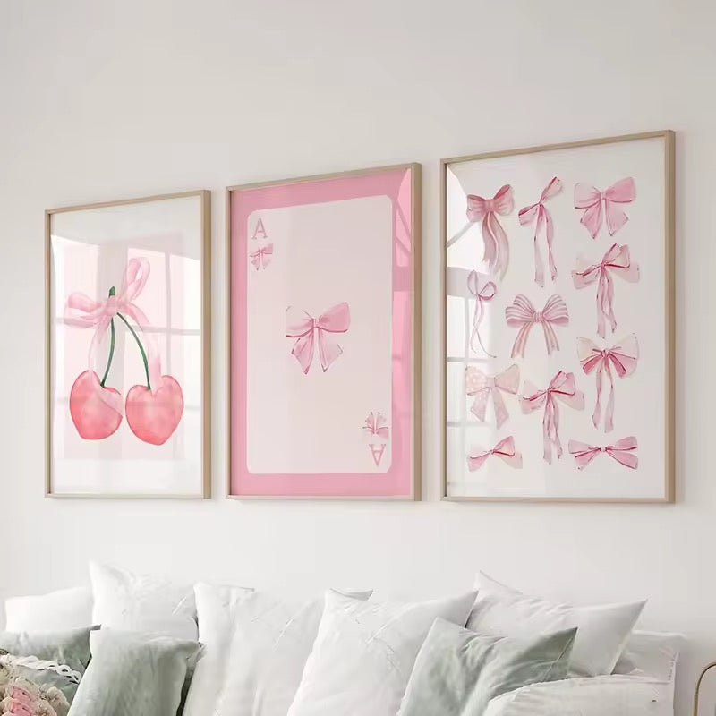 Preppy wall decor showing framed pink art trio in a minimalist girly living room.