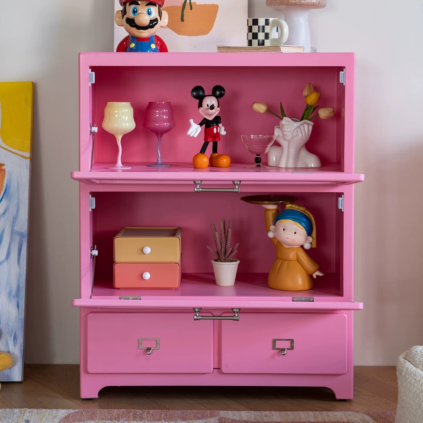 Dopamine pink display cabinet with figurines styled for pastel toycore aesthetic interior decor