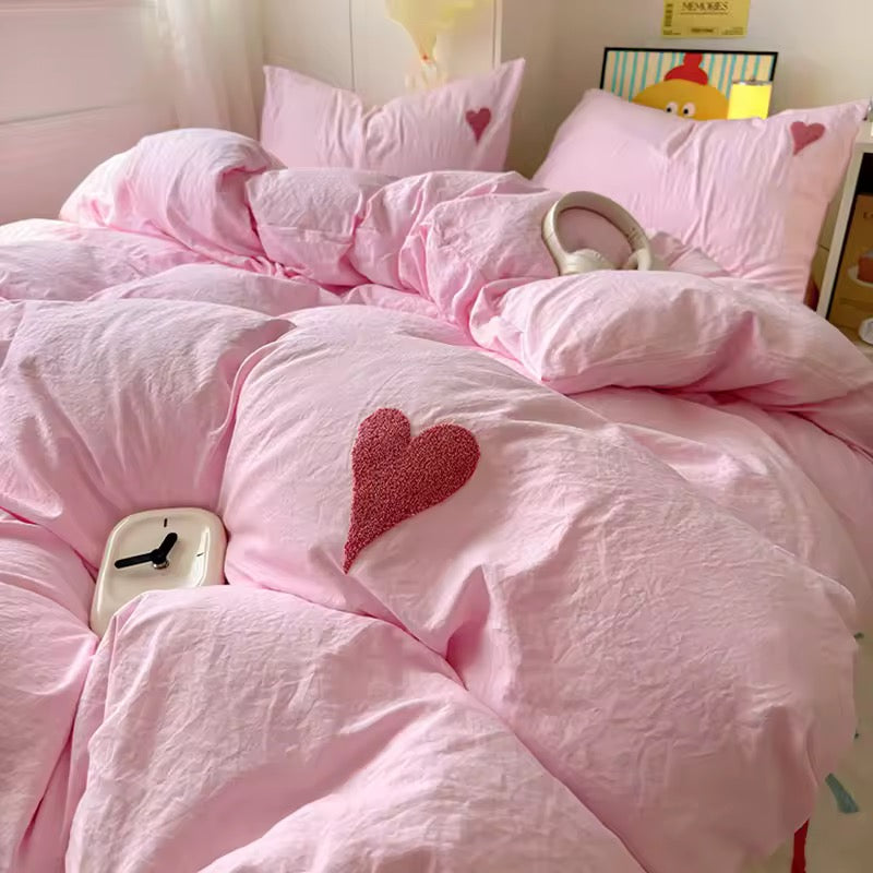 Pink heart embroidered duvet cover displayed in a soft girl bedroom setup