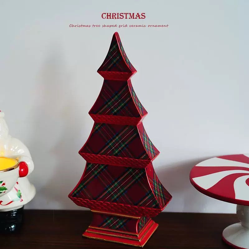 The plaid ceramic tree is turned slightly to show the depth of the tier edges and the shape of the base.