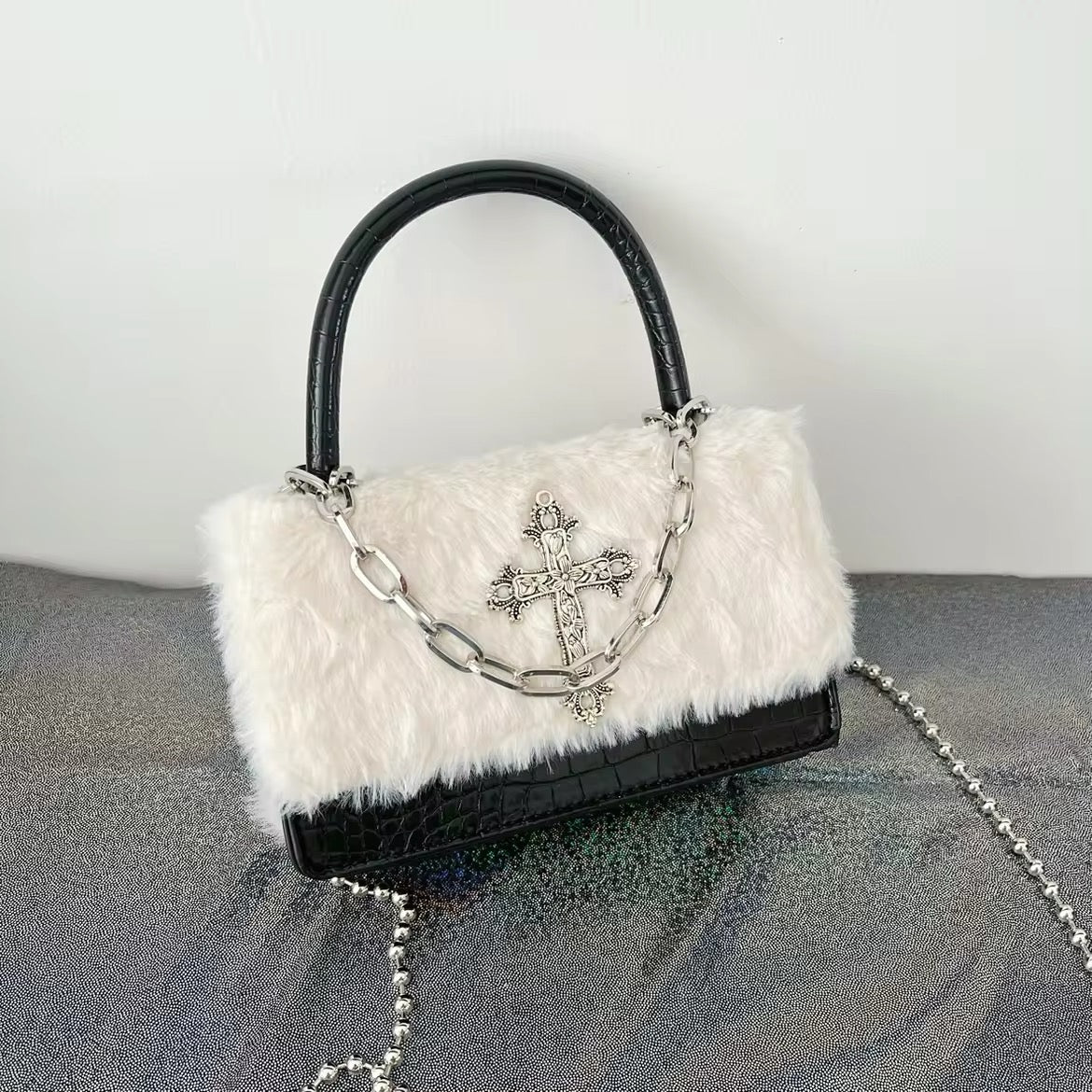 Grunge-inspired Y2K handbag with plush leather and gothic cross design. Stylish crossbody bag for women’s hip hop fashion.