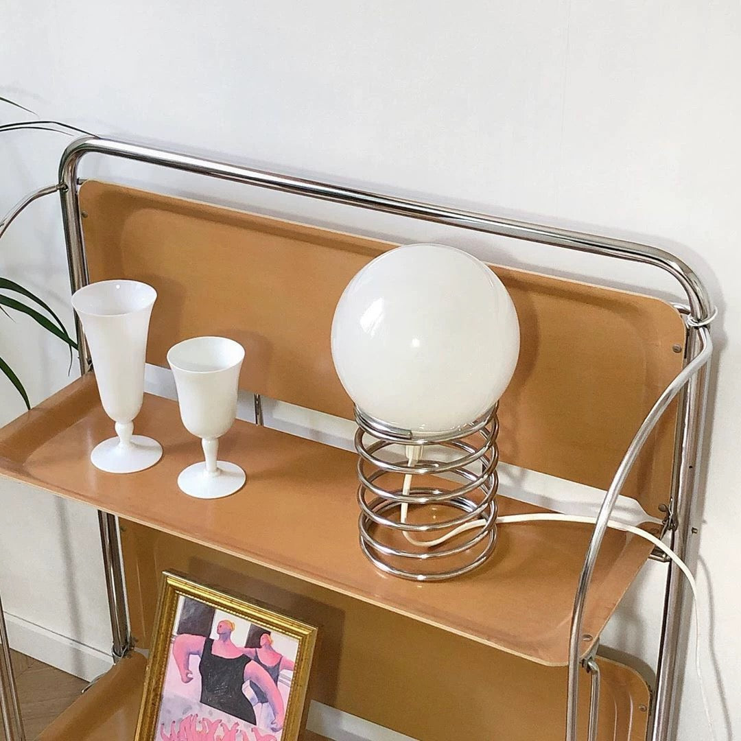 Overhead shot displaying the lamp's compact footprint on a desk