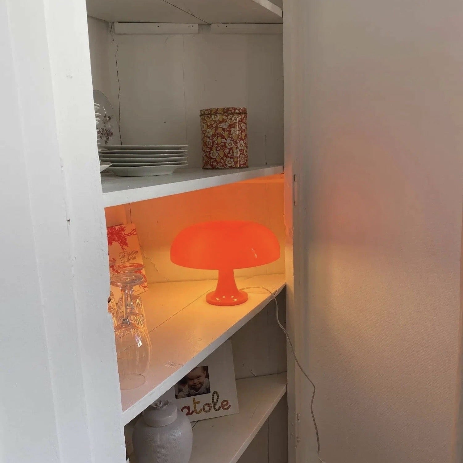 Retro Bauhaus orange mushroom lamp for bedside and desk use. Stylish and functional light for modern and vintage decor.