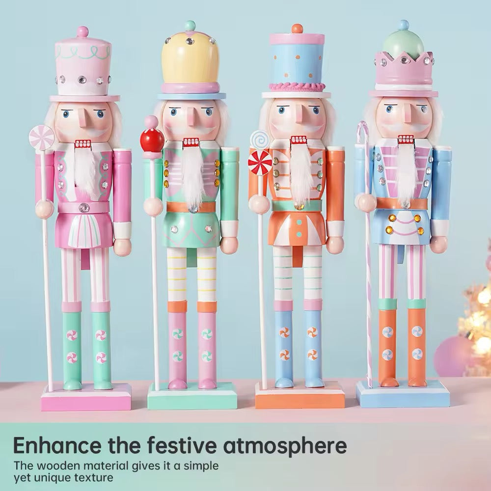 Pink macaron nutcracker soldier figurine. Elegant wooden Christmas ornament for festive home and office decor.