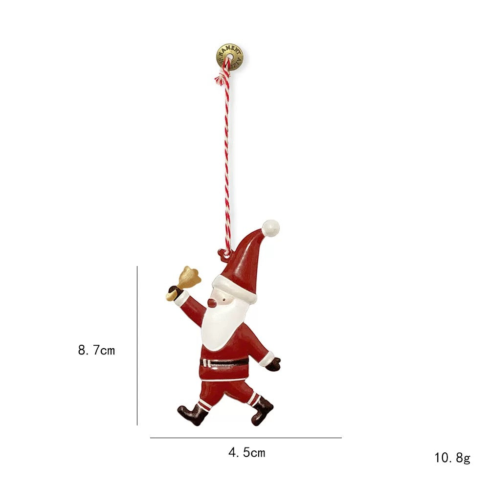 Scandinavian Christmas ornaments include this red Santa with a white beard and a raised gold bell.