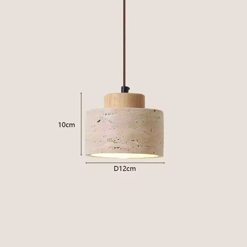 Nordic cylinder pendant light with textured beige shade and warm ambient lighting for dining area.