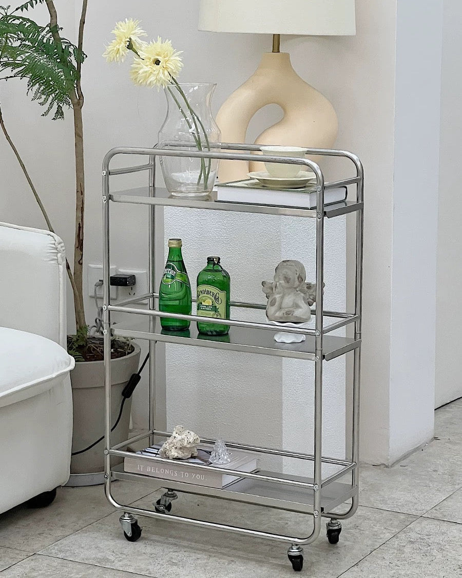 Silver metal bar cart styled with cups, candles, and decor for Korean minimalist home.