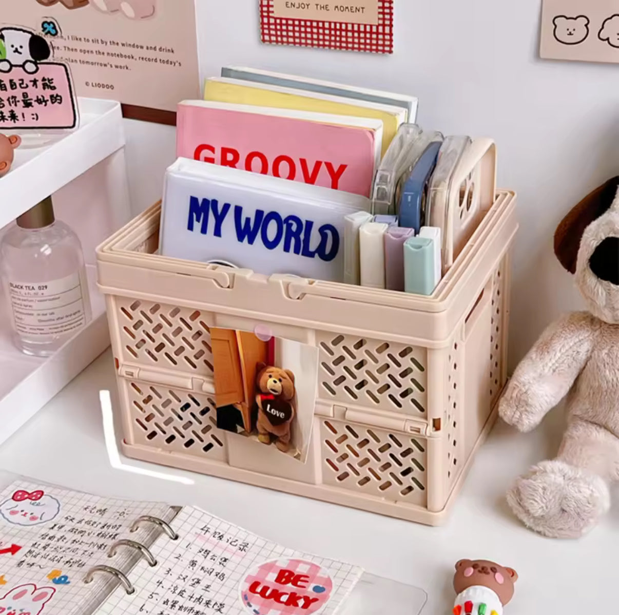 The Feelz organizer box shown folded flat beside a laptop and books