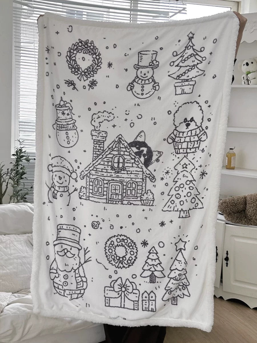 Snowy Christmas throw blanket hanging vertically to show the full winter design