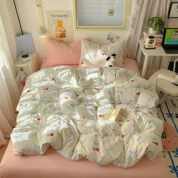 Kawaii cherry and bow duvet cover displayed in a pastel bedroom aesthetic setup.