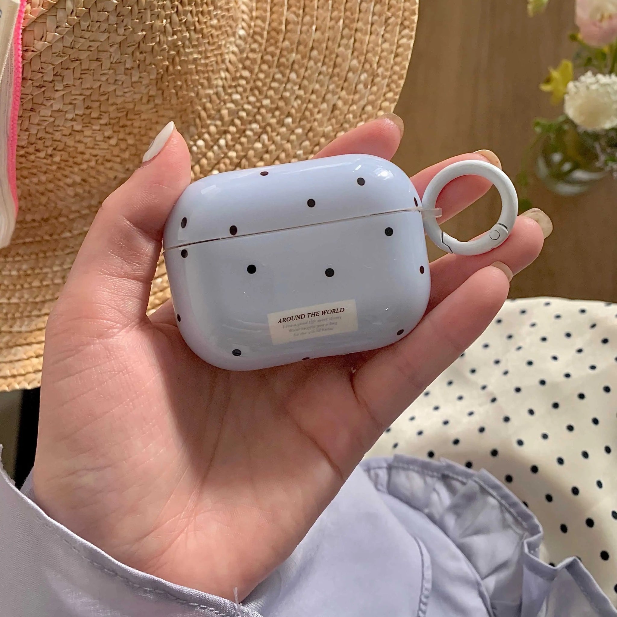 Blue AirPods case with minimalist dot pattern