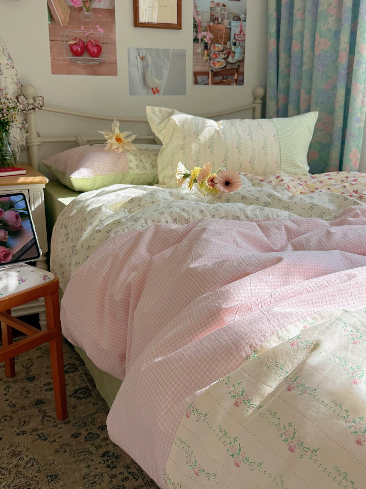 Spring floral duvet cover with pink patchwork folded across the bed