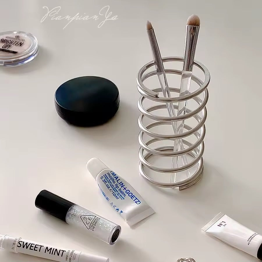 Front view of stainless steel spring holder showcasing its sleek design and compact size