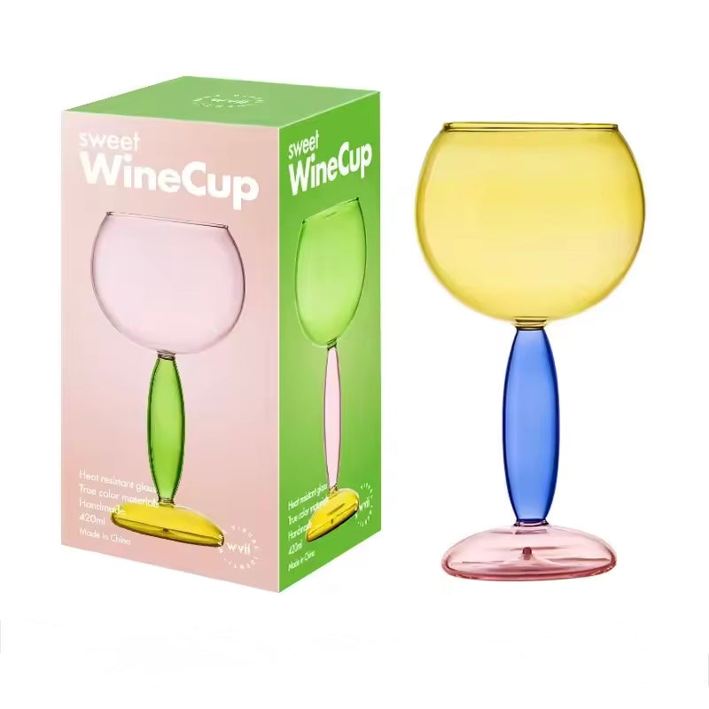 Colorful wine glass with a matching packaging box on a white background