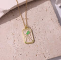 Intricately designed pink tarot card pendant necklace, a symbol of mystery and intrigue.