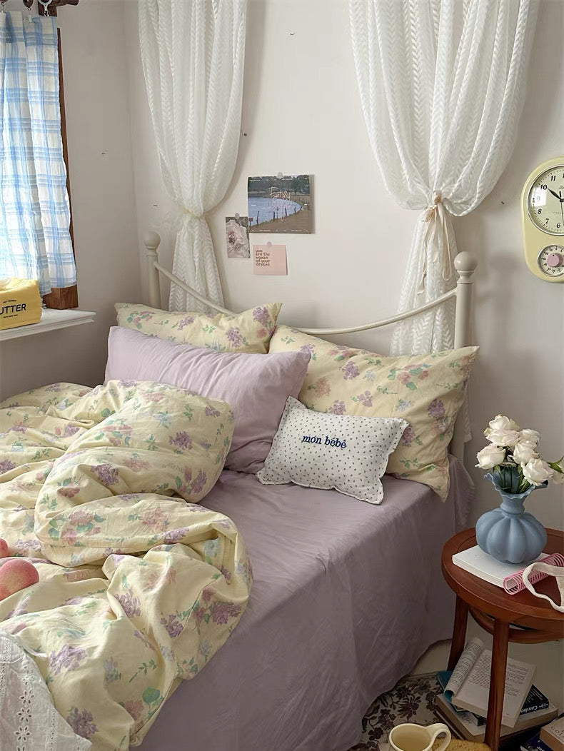 Vintage floral cotton bedding set featuring butter yellow duvet cover with delicate lavender botanical print beautifully