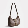 Vintage crescent retro bag with PU leather. Stylish Y2K underarm bag for women featuring a coffee color and niche Maillard style.