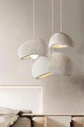 Wabi Sabi chandelier with adjustable wire above round table