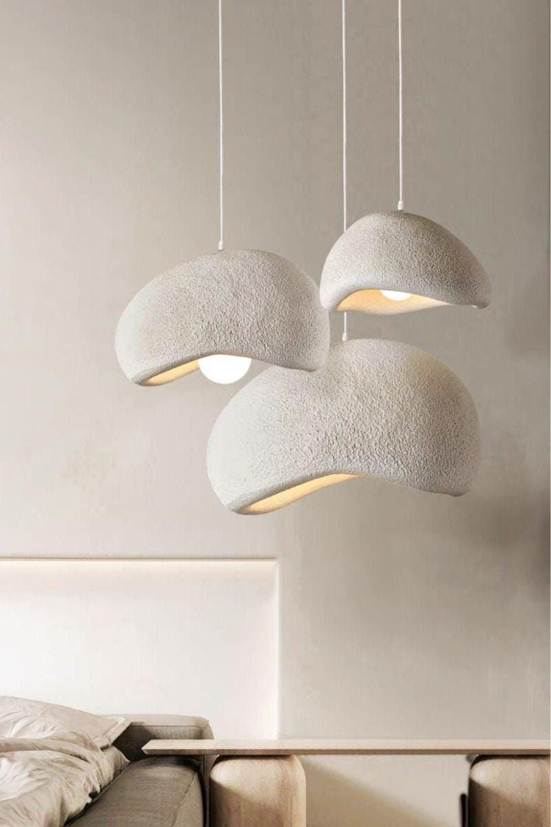 Wabi Sabi chandelier with adjustable wire above round table