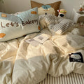 Relaxing girl’s room with warm toned duvet and bakery-themed decor