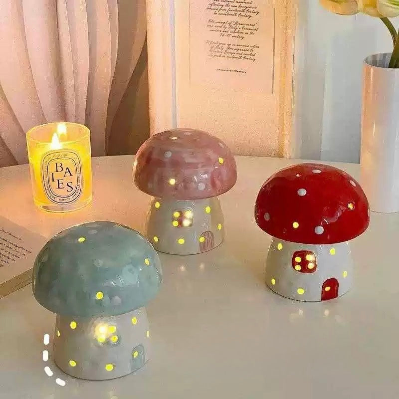 Ceramic mushroom lamp in warm orange glow on a shelf