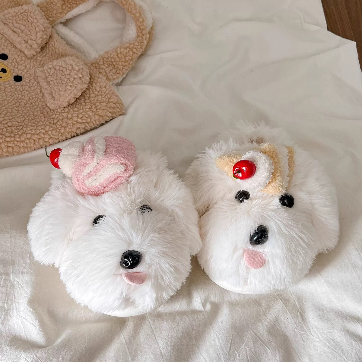White cake dog slippers with cherry-topped dessert details