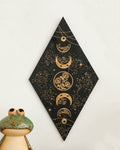 Spiritual room decor featuring moon phase wooden wall art