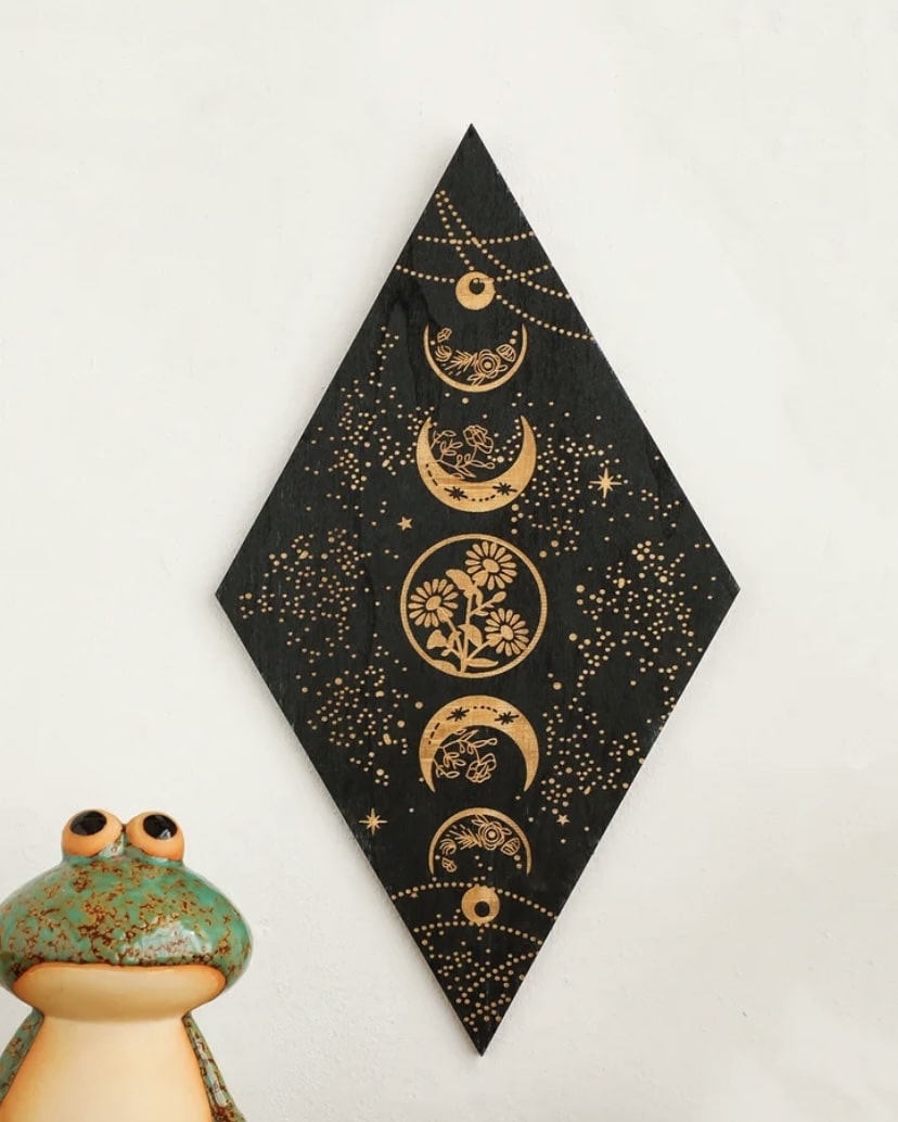 Spiritual room decor featuring moon phase wooden wall art