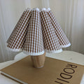 Nordic-inspired wooden night table lamp. Perfect for creating cozy ambiance in bedrooms or living spaces.