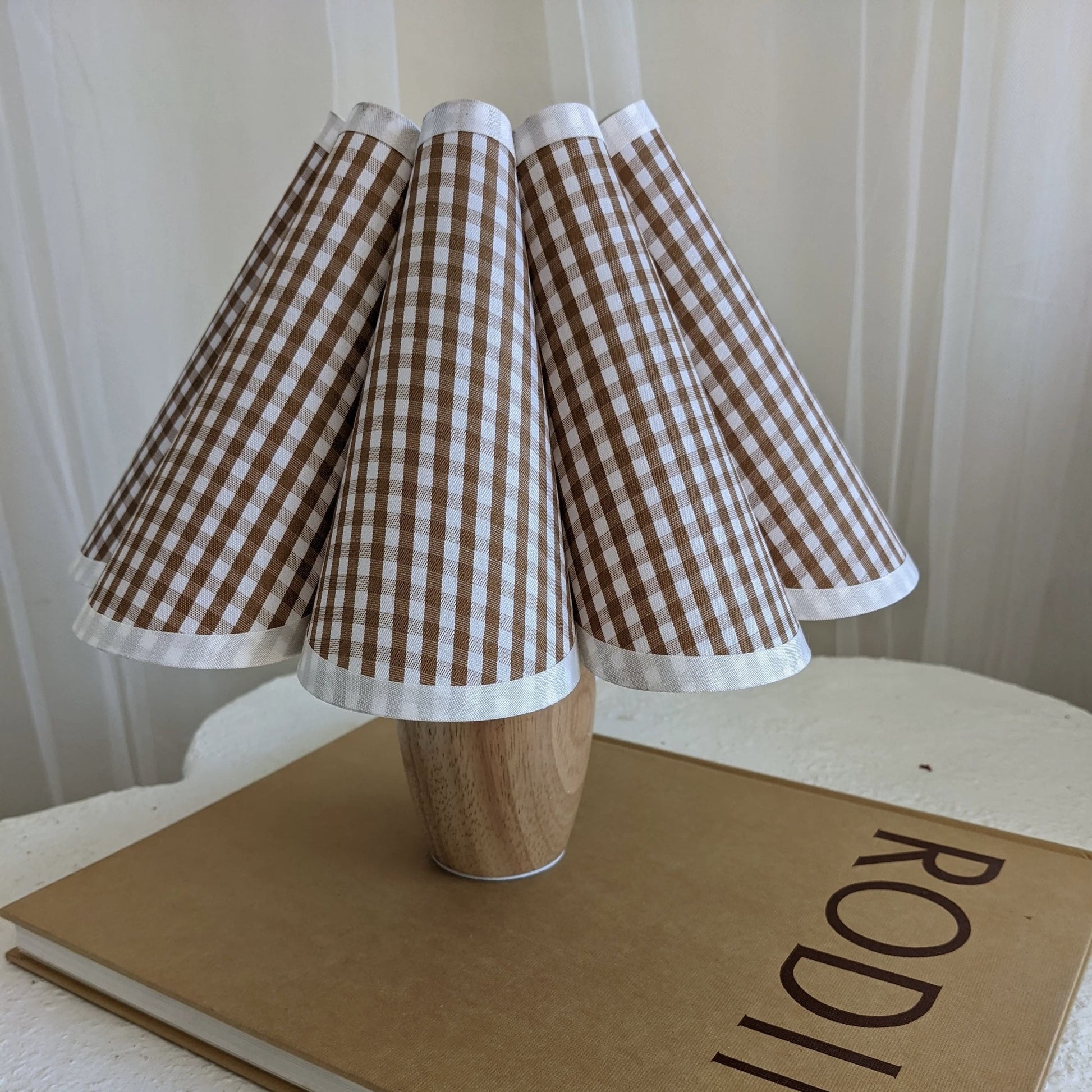 Nordic-inspired wooden night table lamp. Perfect for creating cozy ambiance in bedrooms or living spaces.