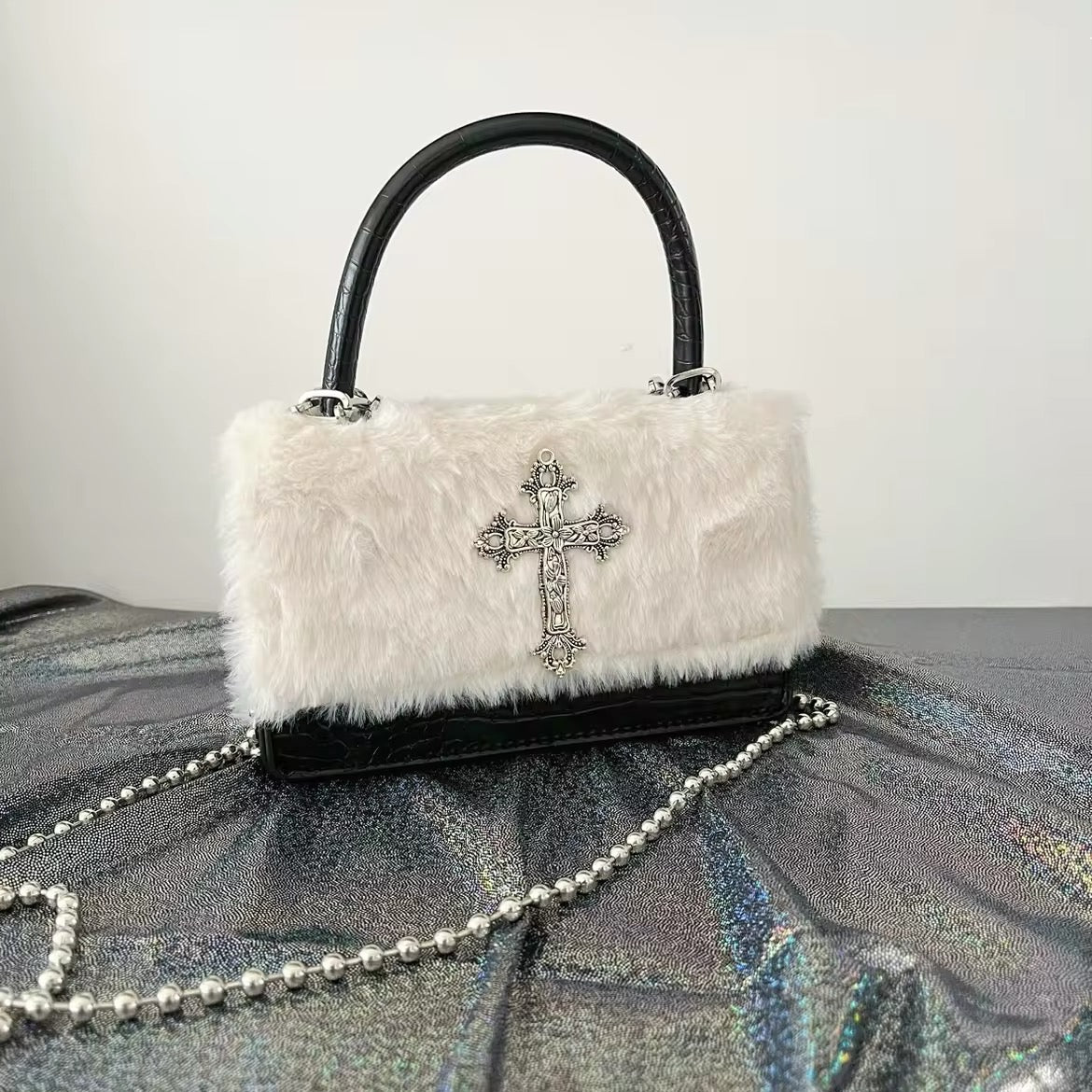 Black gothic handbag with plush leather and chain strap. Y2K aesthetic crossbody bag for women’s Harajuku fashion.