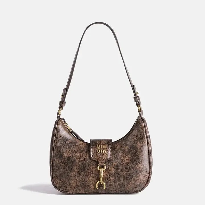 Y2K aesthetic PU leather shoulder bag with crescent shape. Small vintage-inspired handbag perfect for cool girls and spicy girl fashion.